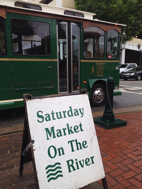 saturday market on the river sign